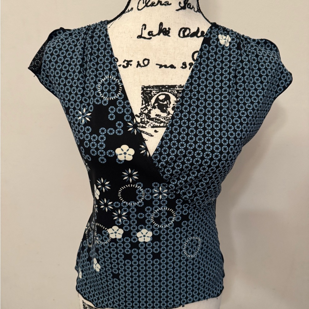 Sleeveless Blue Floral Wrap-Front Blouse